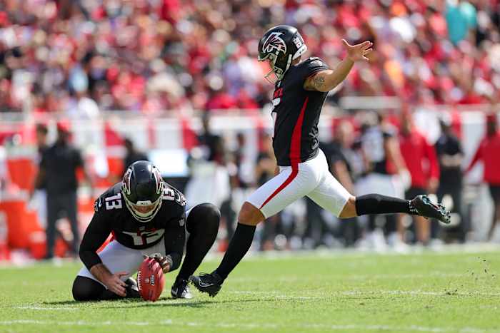 Oct 22, 2023; Tampa, Florida, USA; Atlanta Falcons place kicker Younghoe Koo (6) kicks a field goal held by Atlanta Falcons punter Bradley Pinion (13) against the Tampa Bay Buccaneers in the first quarter at Raymond James Stadium. Mandatory Credit: Nathan Ray Seebeck-USA TODAY Sports
